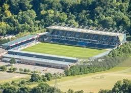 12th WYCOMBE: A lovely location and the atmosphere must be helped by fans not being able to get  wifi on their phones. They have no choice but to watch the football.