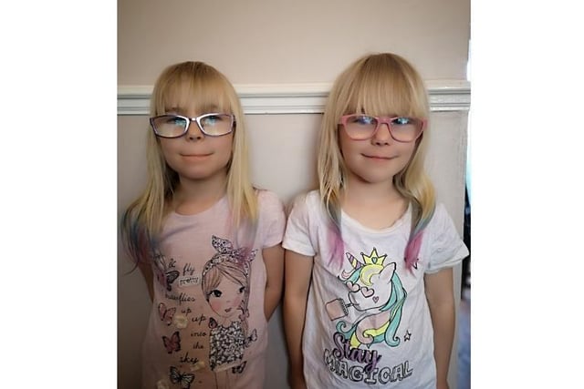Six-year-old twins Kyra and Elana show off their lockdown hair styles