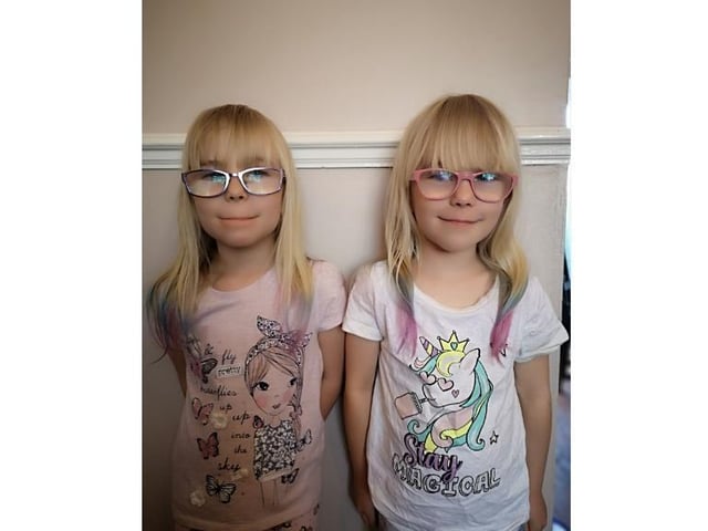 Six-year-old twins Kyra and Elana show off their lockdown hair styles