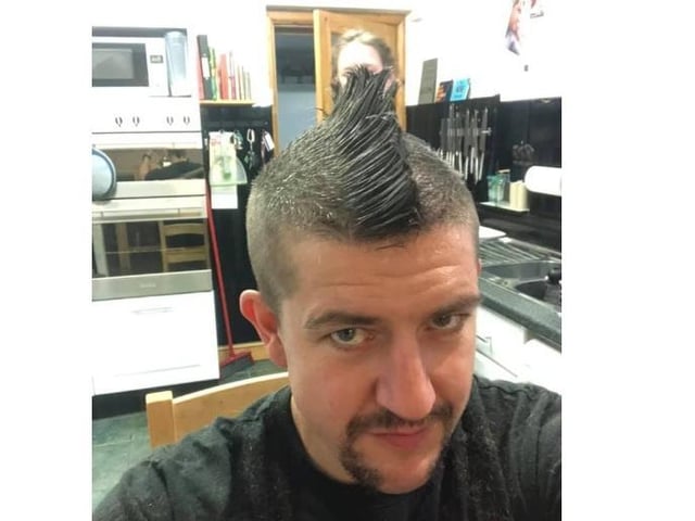 Robert Lee ent in this photo of his new hair style