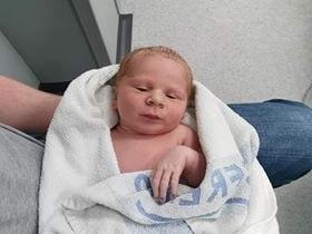 Born at KGH via emergency C-section March 26, weighing 8lb 4oz.