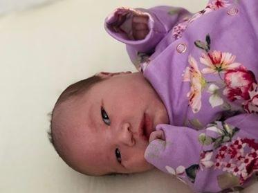 Born safely at home on April 30 delivered by her daddy minutes before the midwife arrived. Her older brother and sister also helped!