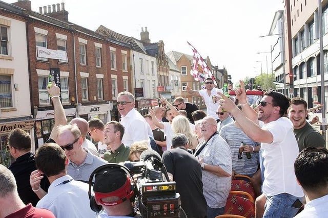 The Cobblers players enjoyed a party all the way to the town centre