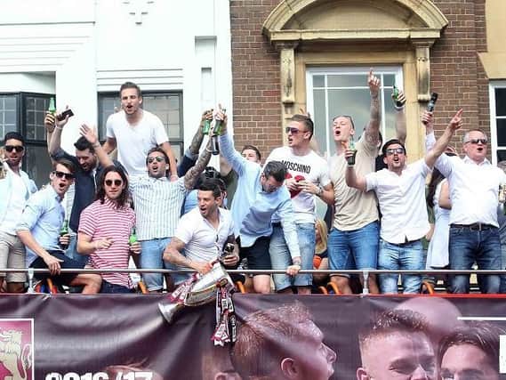 The Cobblers celebrate on their open top bus parade