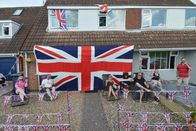 Michael Crook of Willow Crescent celebrates VE Day with his huge Union flag and neighbours.
PICTURE: ANDREW CARPENTER