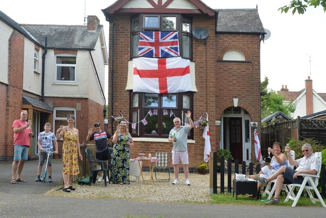 Neighbours celebrated at a distance on Coventry Road in Market Harborough.
PICTURE: ANDREW CARPENTER