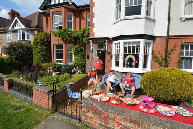 Lutterworth neighbours the Lynch family and the Warren family celebrate VE Day in their front gardens on Bitteswell Road.
PICTURE: ANDREW CARPENTER