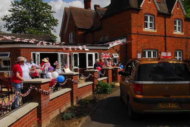 A wave to friends and family for the first time in eight weeks at the St Andrew's Care Home drive-by event on VE Day.