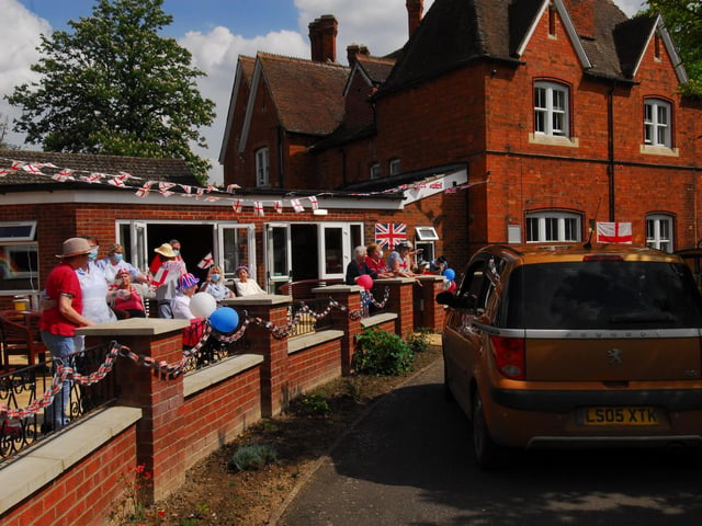 A wave to friends and family for the first time in eight weeks at the St Andrew's Care Home drive-by event on VE Day.