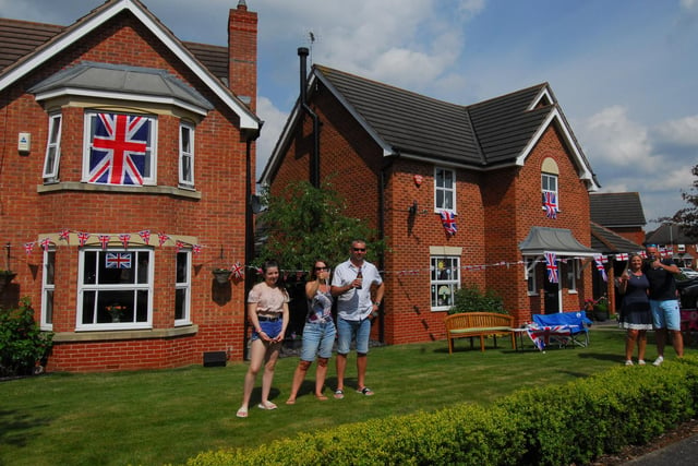Families decorate their homes on Sheldrake Road, Sleaford, left - Jeff, Amanda and Isabella King; right - Katie and Mark Brockington.