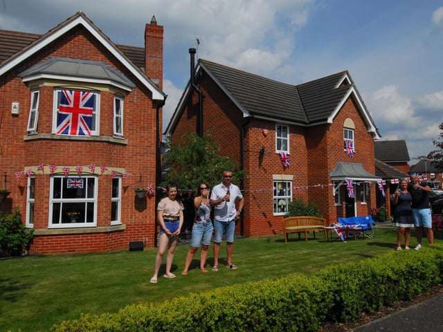 Families decorate their homes on Sheldrake Road, Sleaford, left - Jeff, Amanda and Isabella King; right - Katie and Mark Brockington.