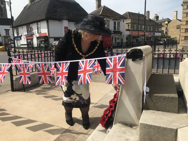 Wreath laying at the Whittlesey war memorial on VE Day. Photo: Robert Windle