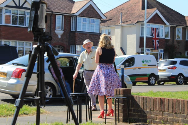 Singer Kim Bonsor gave a live VE Day performance from her front garden in St Andrew's Road, Worthing