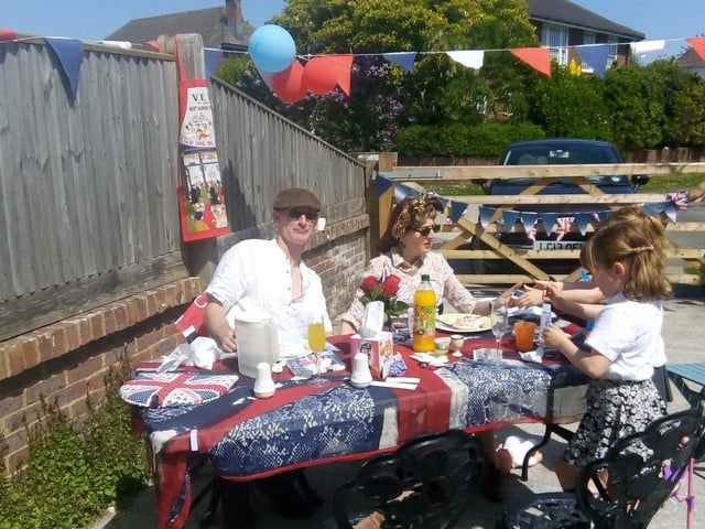 Gina Penn and husband Nigel with twins Sasha and Scarlet celebrating VE Day in St Mary's Close, Littlehampton