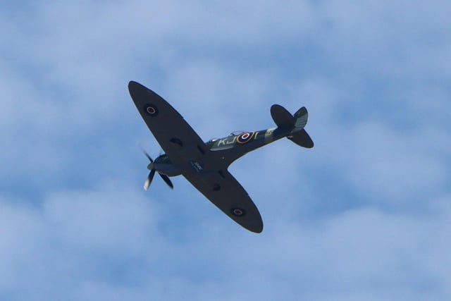 Imogen Marshall took this picture of the Spitfire flypast and said it was a 'lovely surprise to see Thank you NHS written on the underside of the plane'