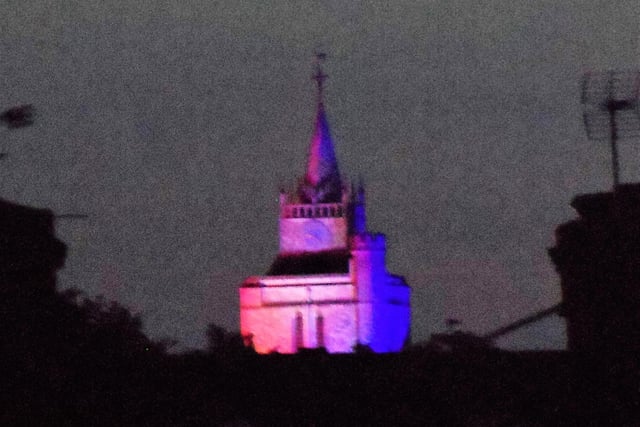 St Mary's Church in Aylesbury lit up in red, white and blue on Friday evening