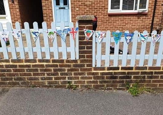 Bethany and Felicity Lehkyj made bunting in Haywards Heath for VE day. SUS-201105-114515001