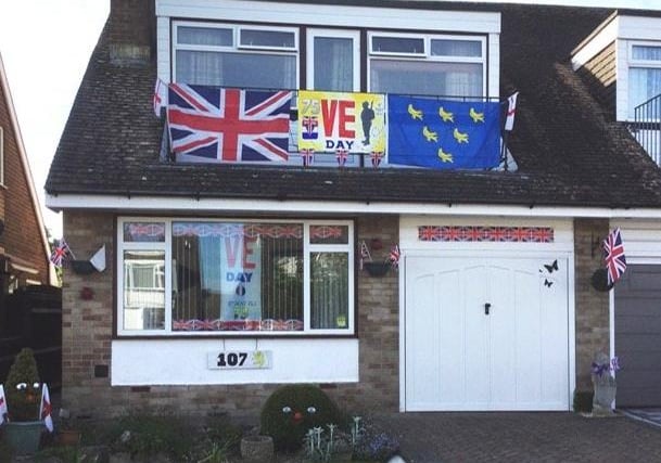 Roger Blackwell, in Greenleaf Gardens, Polegate, decorated the front of his house for VE DAy. SUS-201105-114447001