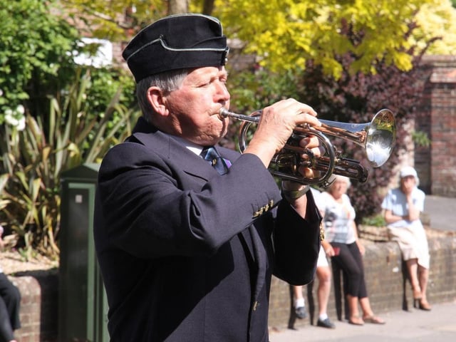 VE Day in Uckfield. At Holy Cross Church Uckfield Ray Martin played the last post and reveille plus a great version of "Over the Rainbow " for the Carers and the NHS., Eric Senior from British Legion was the Standard Bearer. Picture by Ron Hill. SUS-201105-131314001
