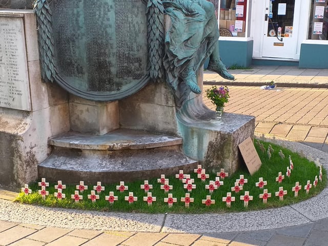 Crosses laid at the foot of Lewes War Memorial. SUS-201105-132351001