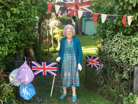 Glyn Jones shared this picture of his grandmother, Daphne Jones, who turned 100 in March, outside her Bognor Regis home. Daphne remembers gathering with people in the centre of Chichester and dancing around the cross on VE Day in 1945