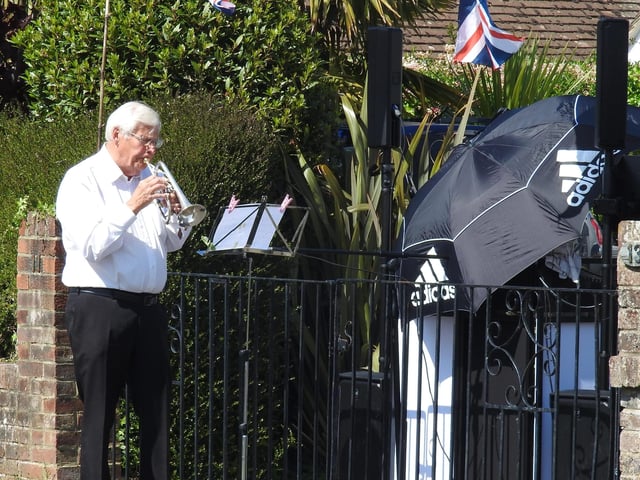 VE Day in Oldfield Road, Lower Willingdon. Ray Bennett plaing the Last Post. SUS-201105-110741001