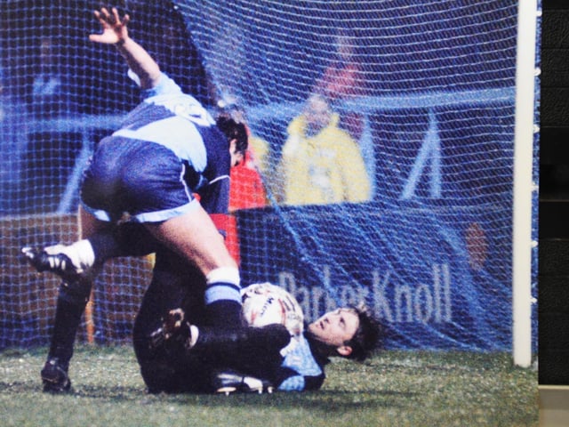 Goalkeeper: IAN FEUER. Country: United States of America. Basketball player-sized keeper who signed on loan from West Ham in 1995. 16 Posh appearances.