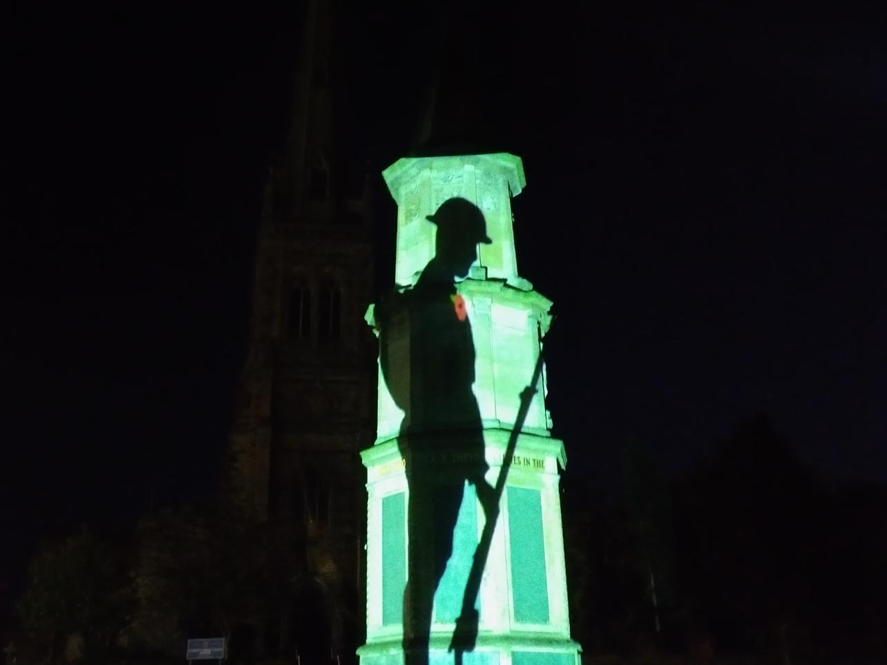 Rushden Cenotaph lit up for VE Day 2020