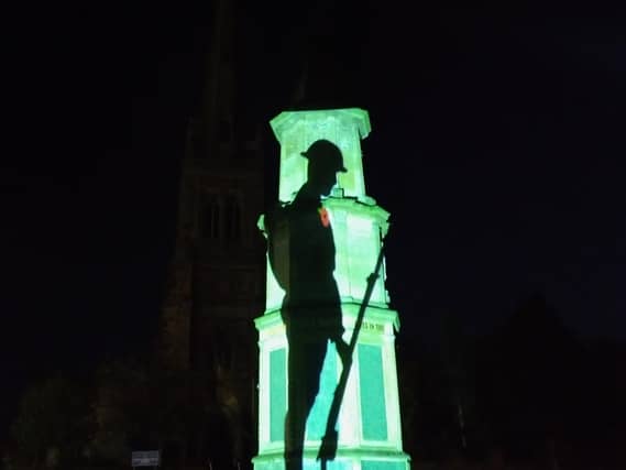 Rushden Cenotaph lit up for VE Day 2020