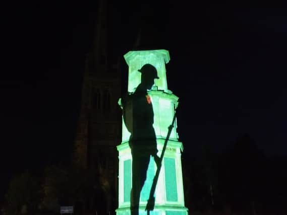 Rushden Cenotaph lit up for VE Day 2020