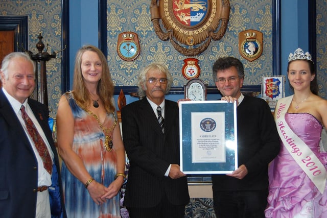 Event organiser Roger Crouch (third from left) being presented with the certificate at Hastings town hall. (Photographer unknown)