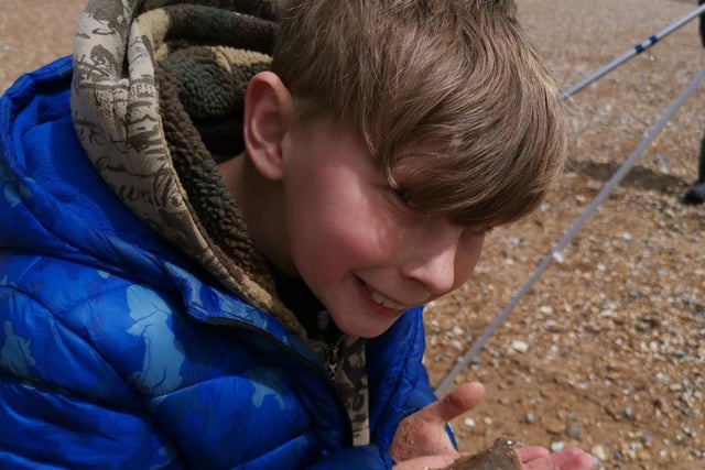 Kaiden Vine with his first fish, a small plaice