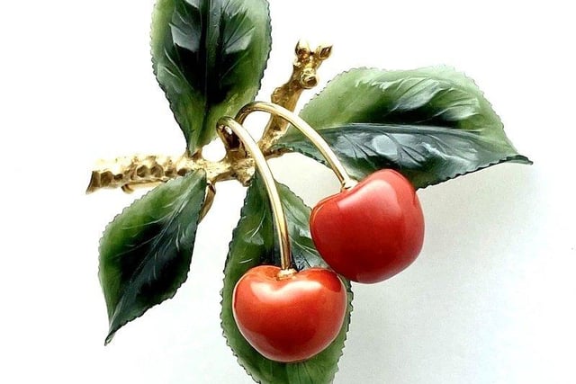 A lapidary 1950s brooch, with coral cherries and nephrite jade leaves on a 14 ct gold branch. Hallmarked Irmgard Bures, Vienna, Austria. Euros 1,450 from Precious Flora