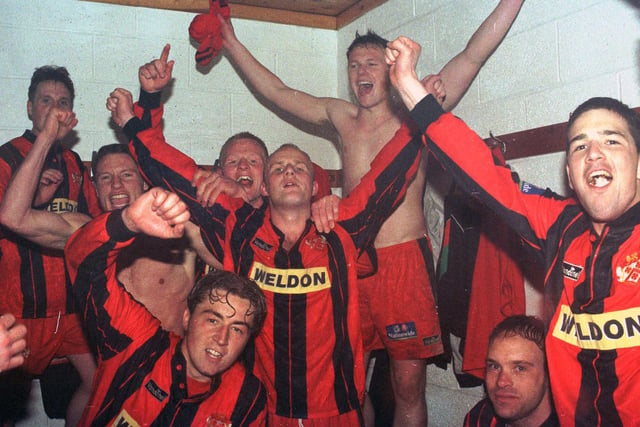 The Kettering players pictured celebrating in the dressing-room after their semi-final at Telford