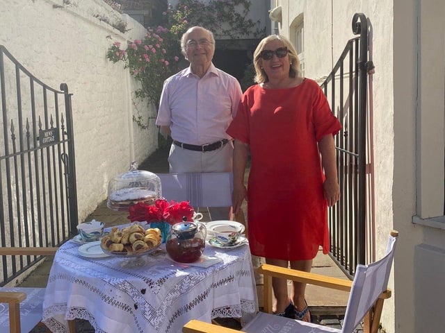 Alison Windle shared these pictures of the residents of Church Hill, Midhurst, enjoying afternoon tea from a safe distance outside their homes