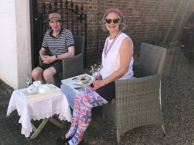 Alison Windle shared these pictures of the residents of Church Hill, Midhurst, enjoying afternoon tea from a safe distance outside their homes