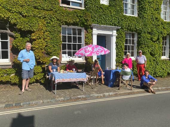 Alison Windle shared these pictures of the residents of Church Hill, Midhurst, enjoying afternoon tea from a safe distance outside their homes
