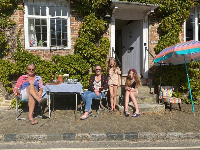 Alison Windle shared these pictures of the residents of Church Hill, Midhurst, enjoying afternoon tea from a safe distance outside their homes