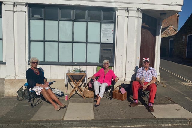 Alison Windle shared these pictures of the residents of Church Hill, Midhurst, enjoying afternoon tea from a safe distance outside their homes