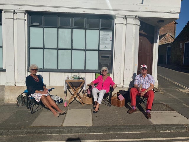 Alison Windle shared these pictures of the residents of Church Hill, Midhurst, enjoying afternoon tea from a safe distance outside their homes