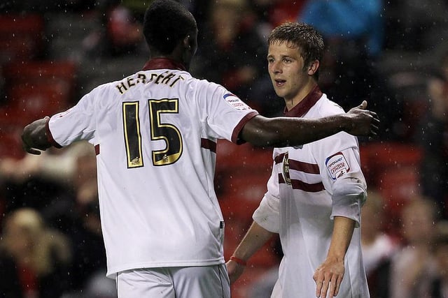 Local lads Courtney Herbert and Michael Jacobs celebrate the Cobblers going ahead
