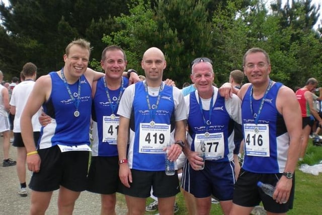 At the 2010 race are members of the Tuff Fitty Tri Club