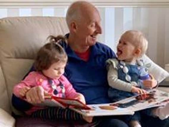 Elaine Alff shared this photo: "Reading to the grandchildren. Oh how we miss being able to hug them!"