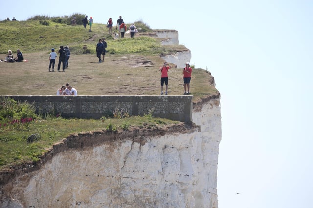 Large numbers of visitors were pictured at Birling Gap on Monday