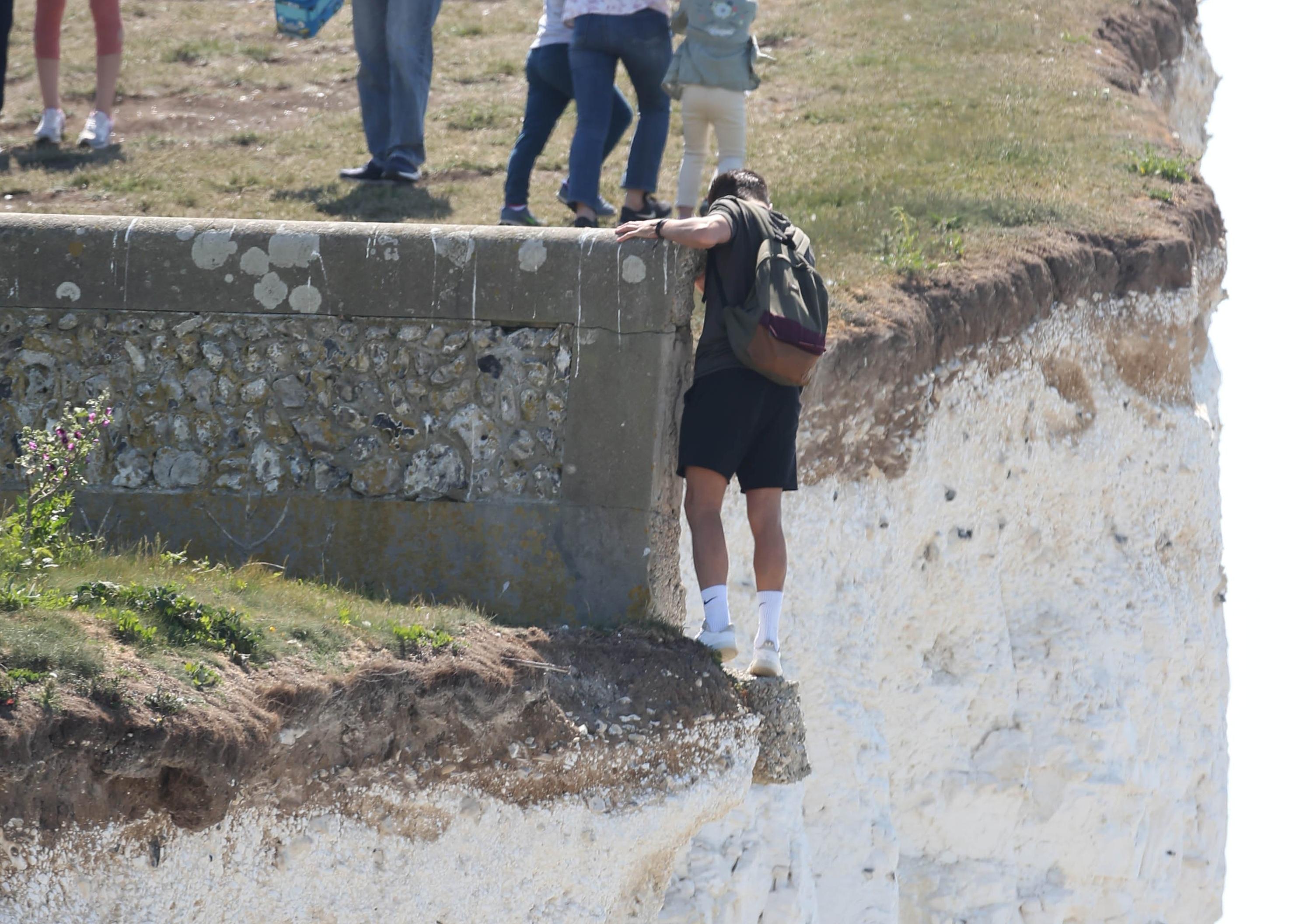 Large numbers of visitors were pictured at Birling Gap on Monday