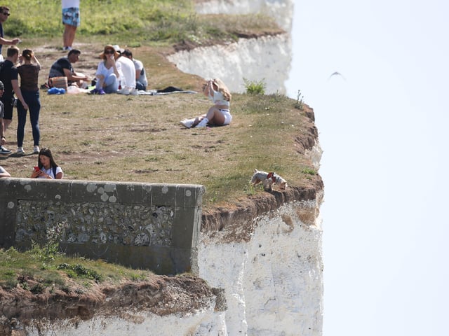 Large numbers of visitors were pictured at Birling Gap on Monday