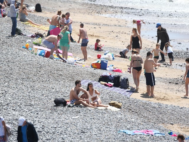 Large numbers of visitors were pictured at Birling Gap on Monday