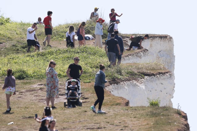 Large numbers of visitors were pictured at Birling Gap on Monday