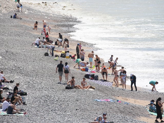 Large numbers of visitors were pictured at Birling Gap on Monday