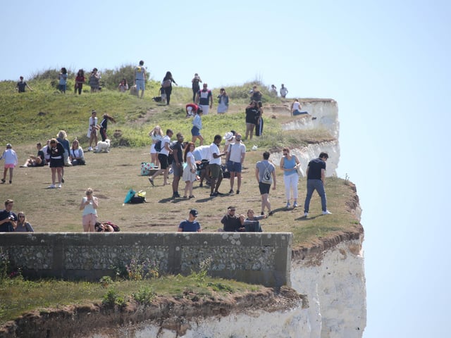 Large numbers of visitors were pictured at Birling Gap on Monday